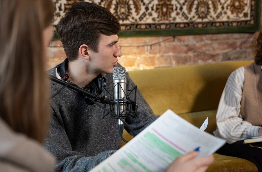 Speaker reviewing a speech document to apply the rule of three for better communication.